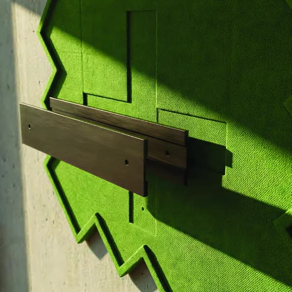 Close detail of modular wall panel and wooden rail.